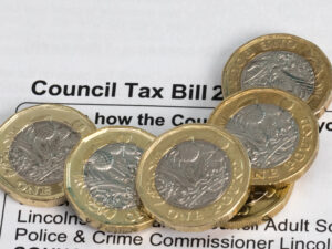 New pound coins on a council tax bill