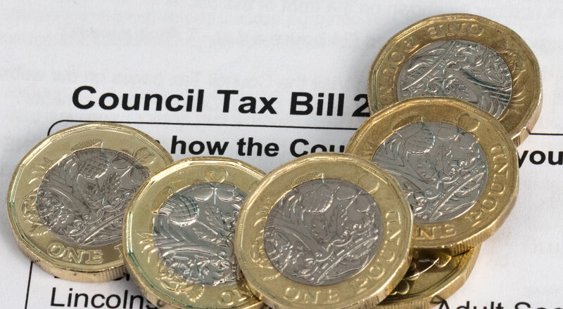 New pound coins on a council tax bill